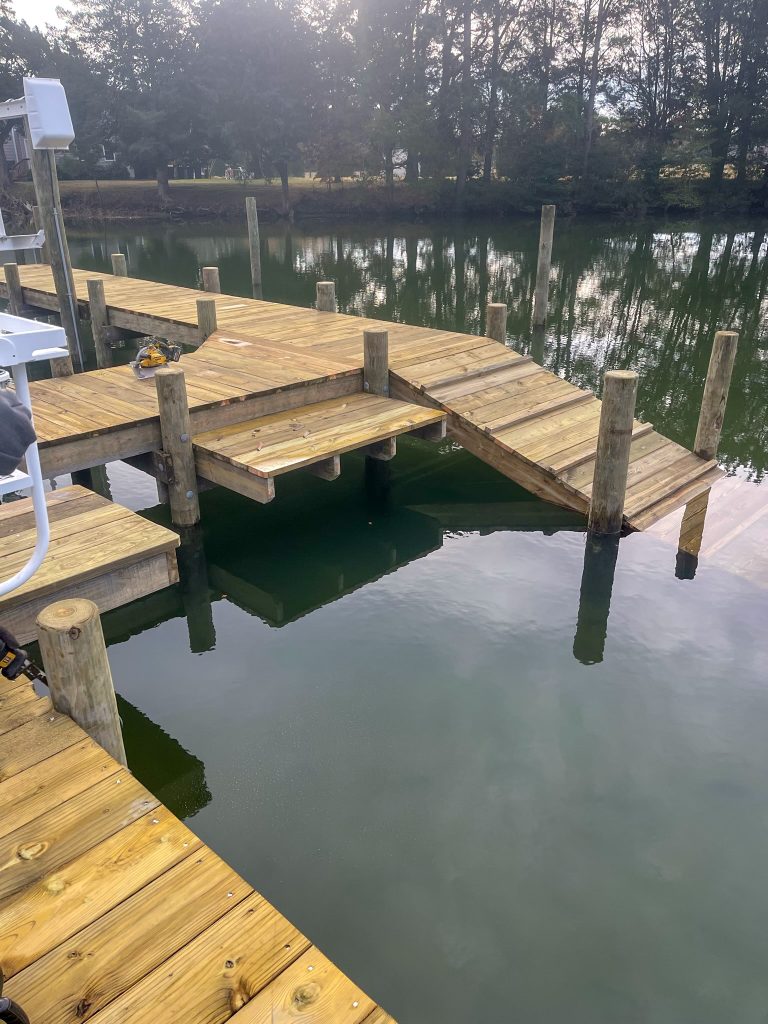 New pier with steps and a ramp down to a lower platform, built by Early Marine Construction